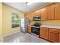 Functional kitchen with stainless steel appliances and ample cabinet space at 1204 Maroon Dr, Durham, NC 27713