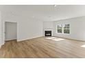 Spacious living room with fireplace, hardwood floors, and plenty of natural light at 121 Cribbs Ln, Middlesex, NC 27557