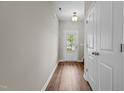 Inviting foyer with hardwood floors, a bright door and a neutral color palette at 124 Myatt Fern Dr, Garner, NC 27529