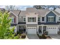 Inviting exterior view of a well-maintained townhome with attached garage at 124 Myatt Fern Dr, Garner, NC 27529