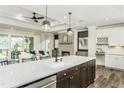 Well-equipped kitchen with stainless appliances and seamless flow to living at 1609 Garden Park Cir, Fuquay Varina, NC 27526