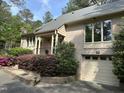 Beautiful one-story brick home featuring an attached garage and landscaped front yard at 202 Selkirk Pl, Durham, NC 27707