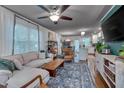 Comfortable living room boasts ample natural light and stylish decor at 2442 Stevens Rd, Raleigh, NC 27610