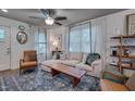 Cozy living space featuring modern furniture, and bright natural light from the windows at 2442 Stevens Rd, Raleigh, NC 27610