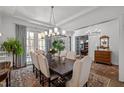 Bright dining room with hardwood floors, neutral paint, a large table, and stylish chandelier at 2908 Stubble Field Dr, Raleigh, NC 27613