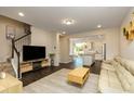Open-concept living room with modern flooring and ample natural light at 313 Kineton Woods Way Way, Garner, NC 27529