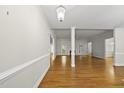 Spacious living room featuring hardwood floors, molding detail and an open layout at 406 N Wakefield St, Zebulon, NC 27597
