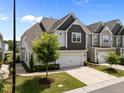 Beautiful two-story home with a well-manicured lawn and inviting curb appeal at 450 Shale Creek Dr, Durham, NC 27703