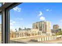 Exterior view features buildings and parking deck under a blue sky at 510 Glenwood Ave # 510, Raleigh, NC 27603