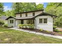 Side view showcasing the home's architecture, landscaping, and inviting walkway at 814 Ellynn Dr, Cary, NC 27511