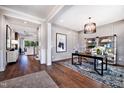 Inviting office space with an area rug, stylish shelving, and decor at 1 Deer Run Trl, Hillsborough, NC 27278