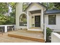 Welcoming front entrance featuring a covered porch and stylish details at 101 Creekview Cir, Carrboro, NC 27510