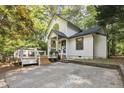 Attractive home with a cozy front deck and well manicured landscaping at 101 Creekview Cir, Carrboro, NC 27510