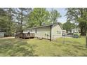 Spacious backyard featuring a wooden deck, perfect for outdoor entertaining and enjoying the green landscape at 1011 Wyldewood Rd, Durham, NC 27704