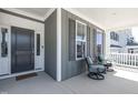 Inviting front porch with seating offering a relaxing outdoor space at 1013 Chelsea Run Ln, Apex, NC 27502