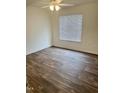 Bedroom with wood floors, a window, and electrical outlets at 1321 Crab Orchard Drive # 203, Raleigh, NC 27606
