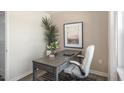 Stylish home office offers a dedicated workspace, accentuated by natural light and elegant decor, perfect for productivity at 176 Holmes Corner Dr, Smithfield, NC 27577