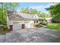 Spacious driveway with two-car garage and well-maintained landscaping at 2008 Elizabeth Ct, Clayton, NC 27520