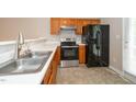 Functional kitchen with stainless steel appliances, ample counter space and a sink at 2253 Violet Bluff Ct, Raleigh, NC 27610