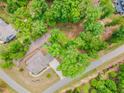 Aerial view showcasing the property's layout, landscaping, and proximity to the surrounding neighborhood at 251 Gentry Dr, Pittsboro, NC 27312