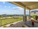 Spacious front porch with stone columns, outdoor seating, and neighborhood views at 30 Futrell Ridge Ct, Chapel Hill, NC 27517