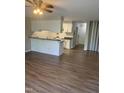 Open-concept layout with breakfast bar flowing from the kitchen into the living area at 3049 Huntleigh Dr, Raleigh, NC 27604