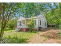 Exterior view of a modest single-story home with a front porch at 331 Highland Ave, Burlington, NC 27217