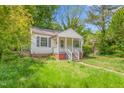 Modest single-story home with a small porch and grassy front yard at 331 Highland Ave, Burlington, NC 27217