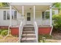 Close up of the front porch and entrance of a single-story home at 331 Highland Ave, Burlington, NC 27217