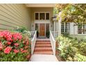 Inviting front entrance with brick steps and colorful landscaping at 53 Westridge Dr, Durham, NC 27713