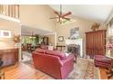 Spacious living room with vaulted ceilings, fireplace, and hardwood floors at 53 Westridge Dr, Durham, NC 27713
