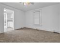 Cozy bedroom with carpeted floors, ceiling fan, and natural light from a window at 605 Dunbar St, Durham, NC 27701