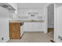 Functional kitchen features white cabinets, a sink, and essential appliances at 605 Dunbar St, Durham, NC 27701