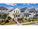 Beautiful two-story home with manicured lawn and a charming front porch at 777 Fireball Ct, Knightdale, NC 27545