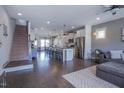 Spacious open-concept living area with hardwood floors and modern decor at 777 Fireball Ct, Knightdale, NC 27545