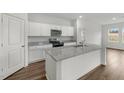 Well-lit kitchen showcasing granite countertops and stainless appliances at 805 Kenyon Spring Dr, Zebulon, NC 27597