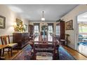 Formal dining room featuring a large table and classic furnishings under a chandelier at 113 Denard St, Oxford, NC 27565