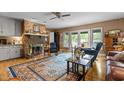 Inviting living room with a brick fireplace and access to an outdoor deck at 113 Denard St, Oxford, NC 27565