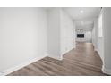 Inviting hallway with wood-look floors leads to an open floorplan at 140 Azure Mist Dr, Raleigh, NC 27610
