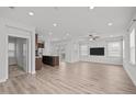Bright and airy living room featuring modern flooring and recessed lighting at 140 Azure Mist Dr, Raleigh, NC 27610