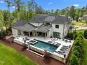 Beautiful backyard featuring a pool, hot tub, and covered patio with outdoor seating at 1416 Bailey Hill Dr, Raleigh, NC 27614