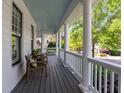 Spacious covered porch with classic columns, perfect for outdoor dining and relaxing with a view at 1416 Heritage Links Dr, Wake Forest, NC 27587
