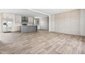 Expansive living area adjacent to a modern kitchen with stainless steel appliances and center island at 17 Star Dust Ln, Selma, NC 27576