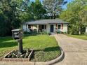 Charming single-story home features a covered porch, well-maintained lawn, and inviting curb appeal at 1708 Sundial Pl, Raleigh, NC 27610