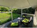 Relaxing front porch with comfortable wicker furniture, perfect for enjoying the outdoors at 1708 Sundial Pl, Raleigh, NC 27610