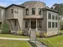 Beautiful home with stone accents, multiple windows and covered entryway creating inviting appeal at 3315 Denada Path, Durham, NC 27707