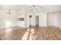 Open concept living and dining area featuring a ceiling fan and breakfast bar at 3325 Tarleton E, Durham, NC 27713