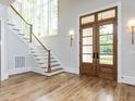 Bright foyer featuring hardwood floors, staircase, and natural light at 40 Ridgeline Ct # 10, Pittsboro, NC 27312