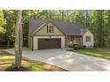 View of a charming single Gathering home with a concrete driveway and attached garage at 4005 Colleen Way, Kittrell, NC 27544