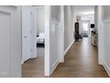 Inviting hallway with hardwood floors leading to a bedroom and living area with lots of space at 49 Kathy Mae Ct, Angier, NC 27501